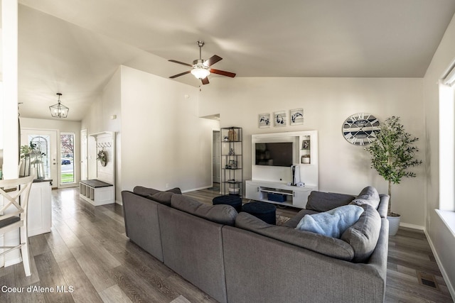 living area featuring high vaulted ceiling, a ceiling fan, baseboards, dark wood-type flooring, and visible vents