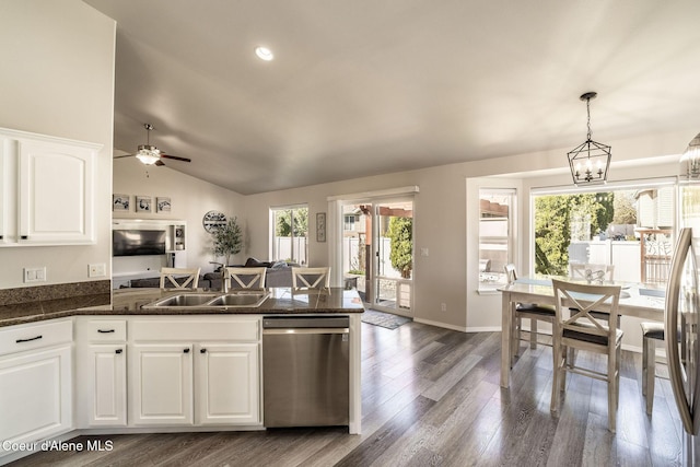 kitchen with dark wood-style flooring, a peninsula, white cabinets, a sink, and dishwasher