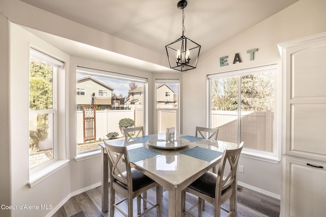 dining room with an inviting chandelier, baseboards, and a healthy amount of sunlight