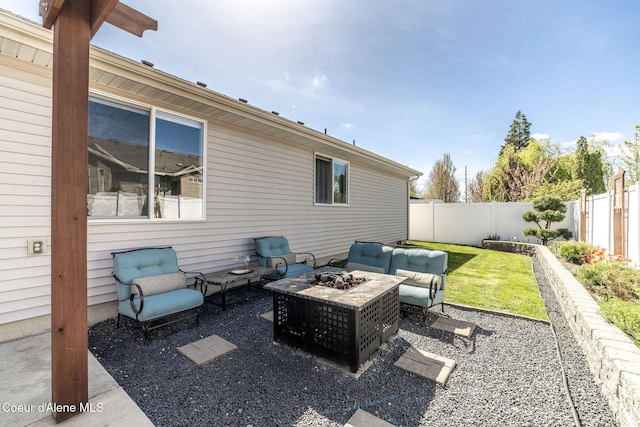 view of patio with a fenced backyard and an outdoor fire pit