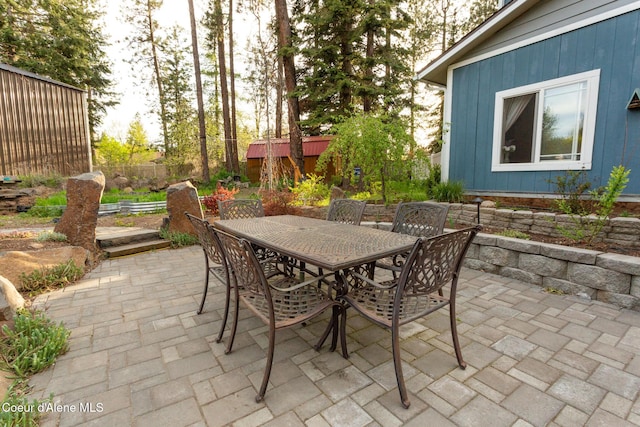 view of patio / terrace featuring fence and outdoor dining space