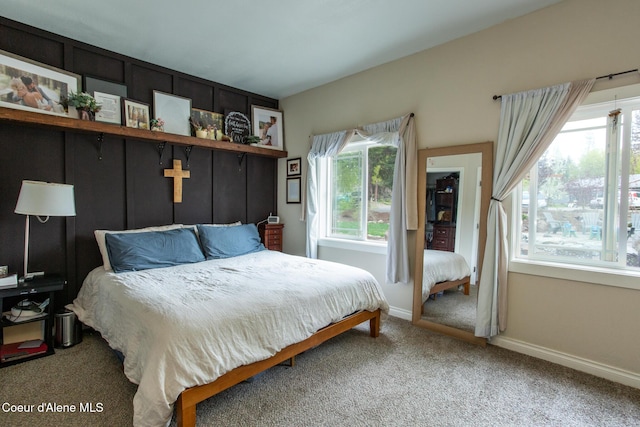 carpeted bedroom with baseboards