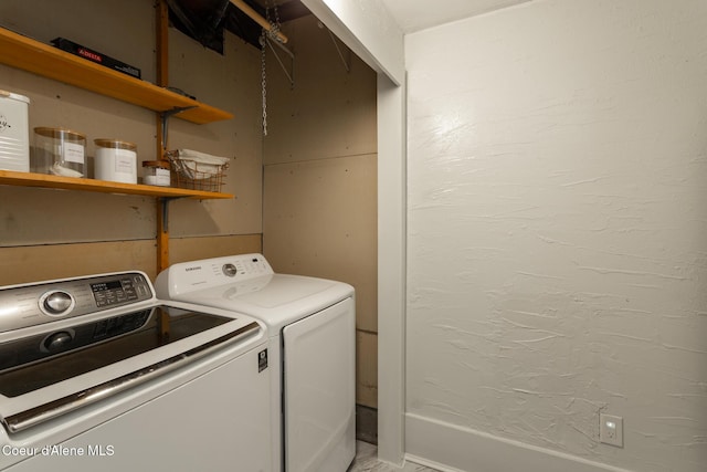 laundry area with laundry area and washing machine and clothes dryer