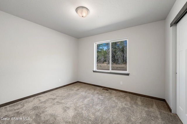 24903 N Old Highway 95, Athol, ID 83801 - unfurnished room featuring carpet and baseboards