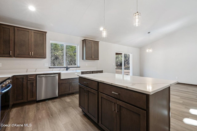 24903 N Old Highway 95, Athol, ID 83801 - kitchen featuring appliances with stainless steel finishes, lofted ceiling, wood finished floors, plenty of natural light, and dark brown cabinets