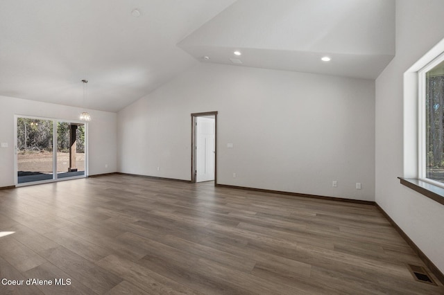 24903 N Old Highway 95, Athol, ID 83801 - unfurnished living room featuring recessed lighting, wood finished floors, a chandelier, and high vaulted ceiling