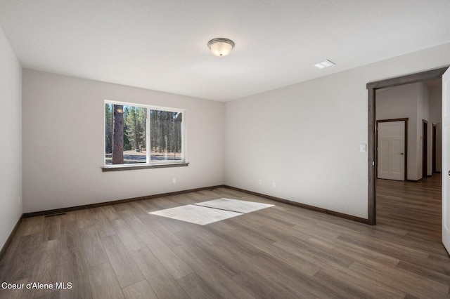 24903 N Old Highway 95, Athol, ID 83801 - unfurnished room with wood finished floors and baseboards