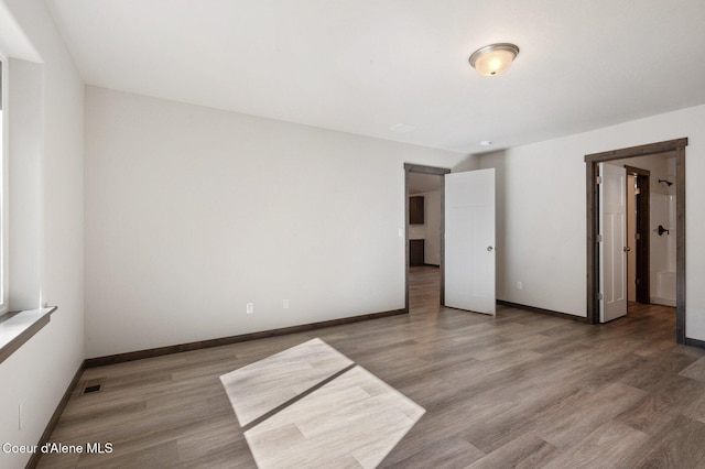 24903 N Old Highway 95, Athol, ID 83801 - unfurnished bedroom featuring baseboards and wood finished floors