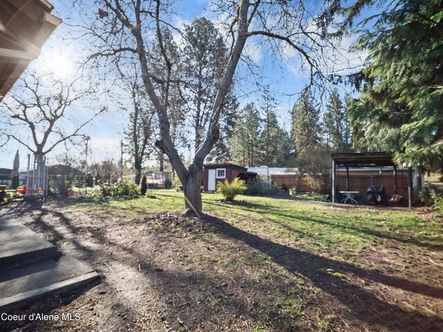 13604/06 E Nora Ave, Spokane Valley, WA 99216 - view of yard featuring fence and an outdoor structure