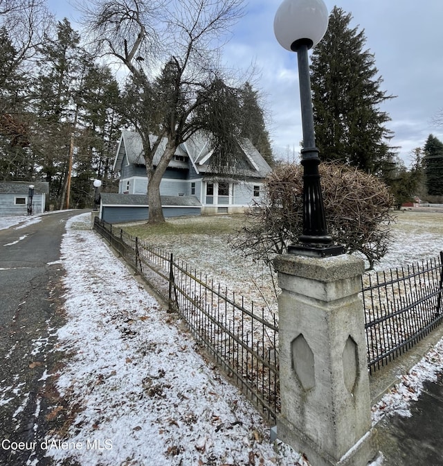 6990 Denver St, Bonners Ferry, ID 83805 - view of snowy exterior featuring fence