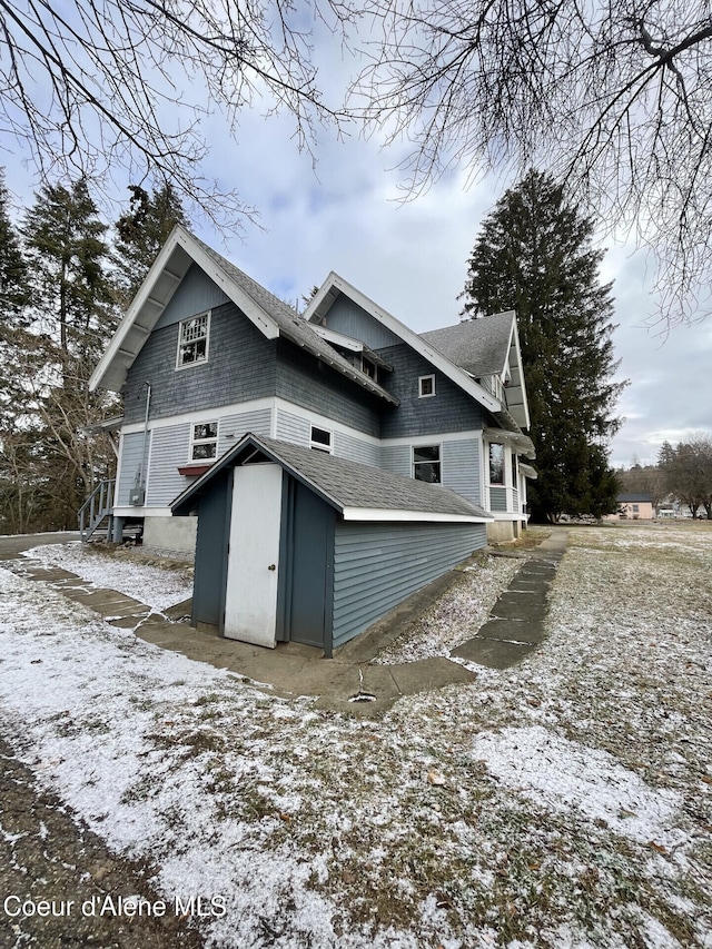 6990 Denver St, Bonners Ferry, ID 83805 - exterior space featuring an outdoor structure, roof with shingles, and a storage shed