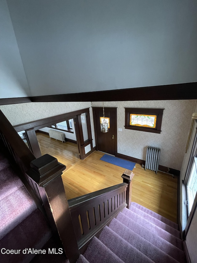 6990 Denver St, Bonners Ferry, ID 83805 - stairs featuring an inviting chandelier and wood finished floors