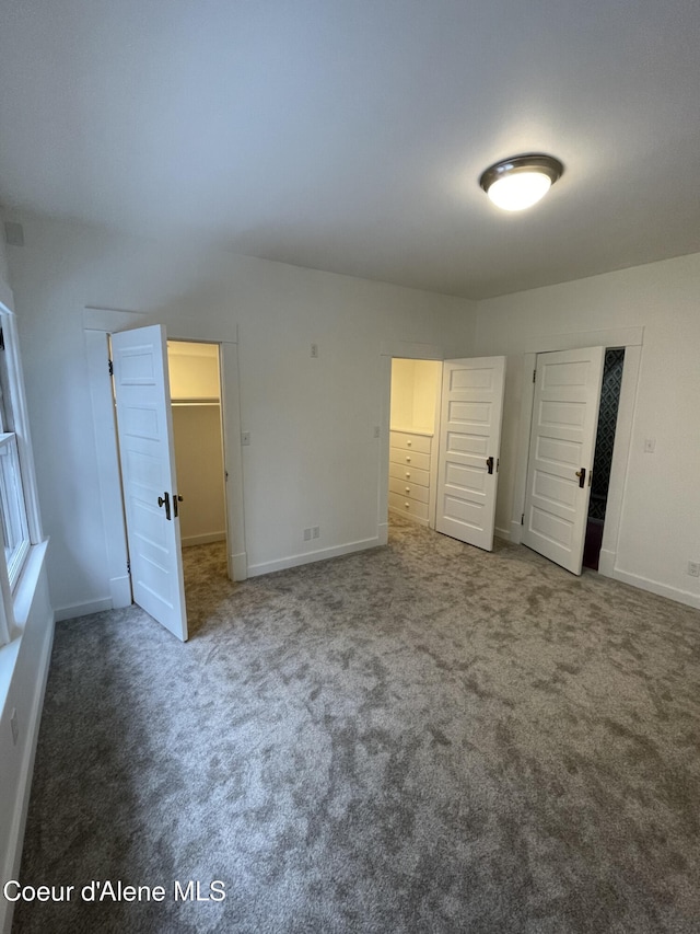 6990 Denver St, Bonners Ferry, ID 83805 - unfurnished bedroom featuring carpet floors, baseboards, and a closet