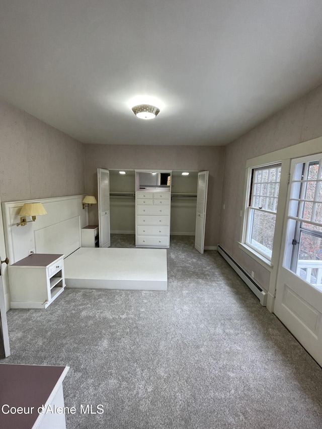6990 Denver St, Bonners Ferry, ID 83805 - unfurnished bedroom with a baseboard heating unit and carpet