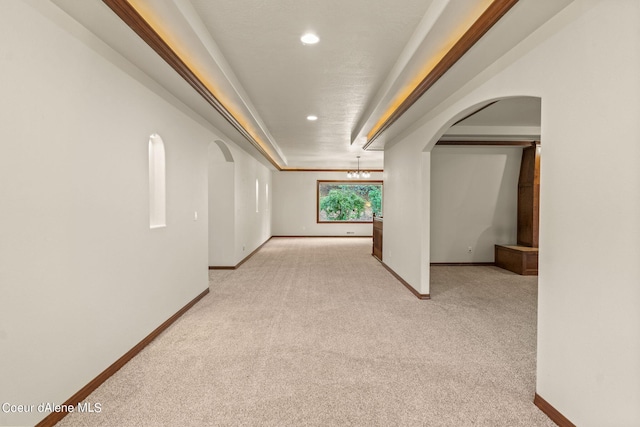 1358 S Starlight Dr, Coeur Dalene, ID 83814 - corridor featuring an inviting chandelier, light colored carpet, arched walkways, recessed lighting, and baseboards