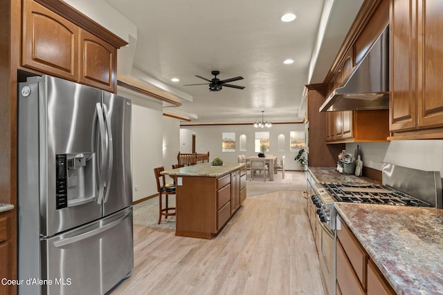 1358 S Starlight Dr, Coeur Dalene, ID 83814 - kitchen featuring stainless steel fridge, extractor fan, stove, ceiling fan with notable chandelier, and a center island