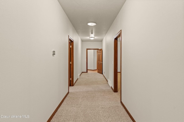 1358 S Starlight Dr, Coeur Dalene, ID 83814 - hallway featuring baseboards and light carpet