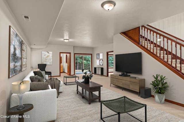 1358 S Starlight Dr, Coeur Dalene, ID 83814 - living area with baseboards, light carpet, stairs, and visible vents