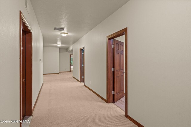 1358 S Starlight Dr, Coeur Dalene, ID 83814 - hall with light colored carpet, baseboards, and visible vents