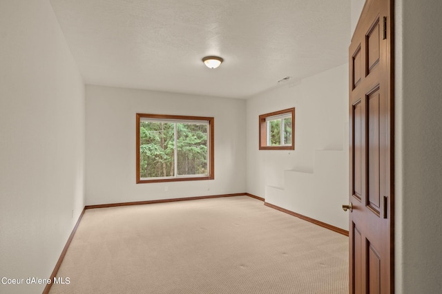 1358 S Starlight Dr, Coeur Dalene, ID 83814 - unfurnished room featuring baseboards, visible vents, and light carpet