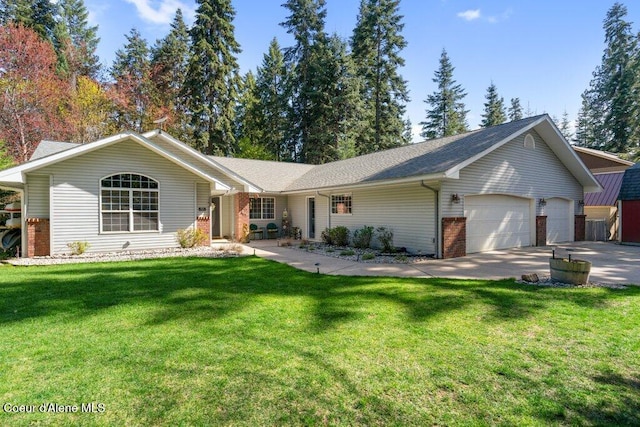 ranch-style house featuring an attached garage, a front yard, driveway, and brick siding