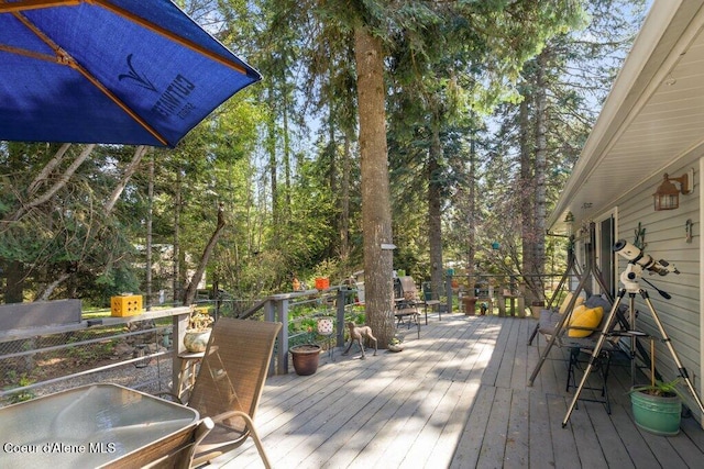 wooden deck featuring outdoor dining space