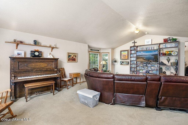 carpeted living room featuring a textured ceiling and lofted ceiling