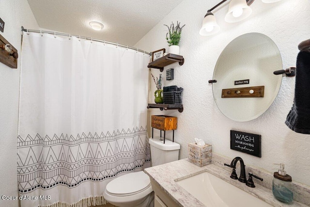 full bath featuring vanity, toilet, a textured ceiling, and a shower with shower curtain