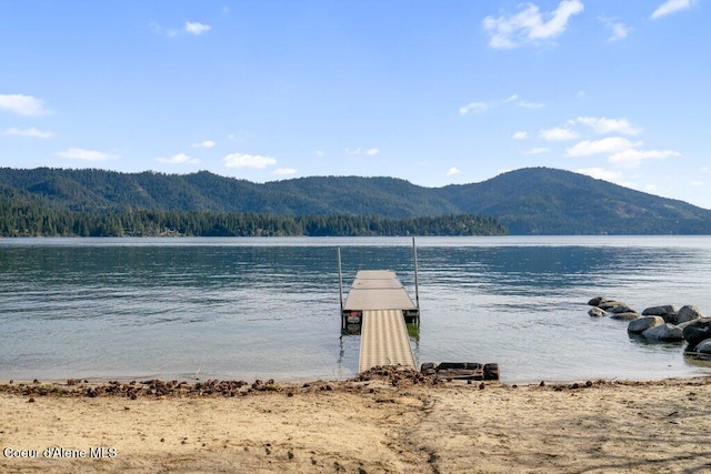 dock area with a water and mountain view