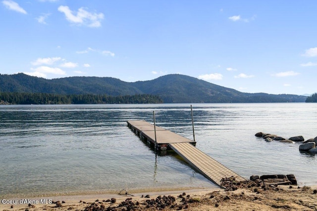 dock area featuring a water and mountain view