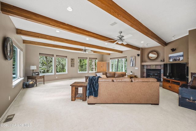 living area featuring recessed lighting, a ceiling fan, light colored carpet, and a tiled fireplace