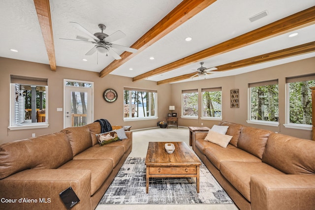 carpeted living room with visible vents, beamed ceiling, baseboards, recessed lighting, and a ceiling fan