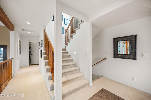 stairway with carpet flooring, recessed lighting, and visible vents