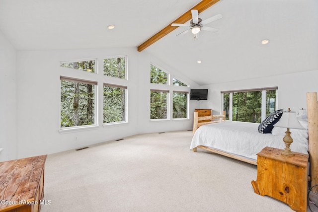 bedroom with carpet floors, visible vents, multiple windows, and vaulted ceiling with beams