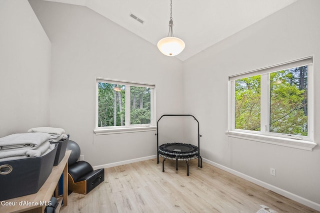 sitting room featuring visible vents, baseboards, and wood finished floors