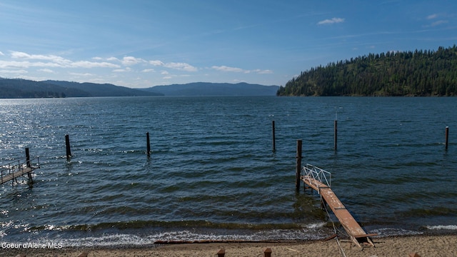 dock area featuring a water and mountain view