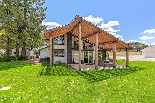 333 E Cedar Ln, Priest River, ID 83856 - back of property with a patio area and a lawn