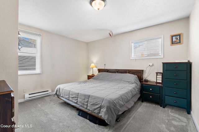 bedroom with carpet floors, baseboards, a baseboard heating unit, and multiple windows