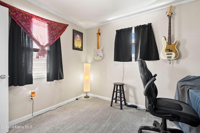 carpeted home office with crown molding and baseboards