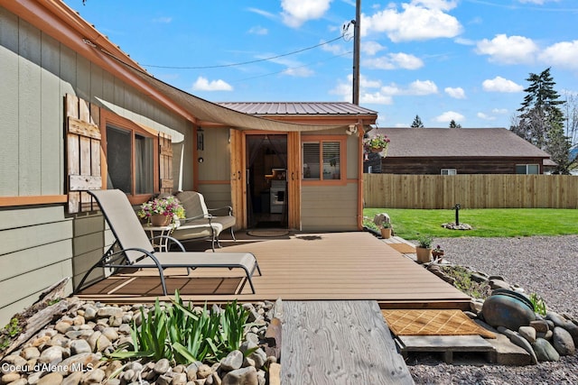 wooden terrace with fence and a yard
