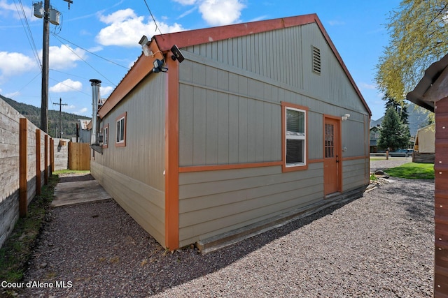 view of property exterior featuring fence