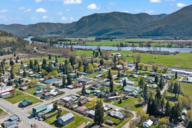 drone / aerial view with a water and mountain view