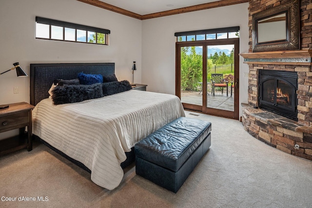carpeted bedroom featuring a stone fireplace, visible vents, access to exterior, and ornamental molding
