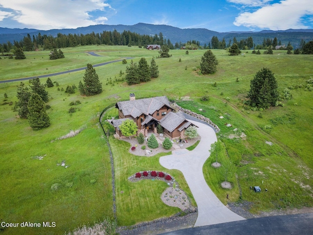 aerial view with a mountain view and a rural view