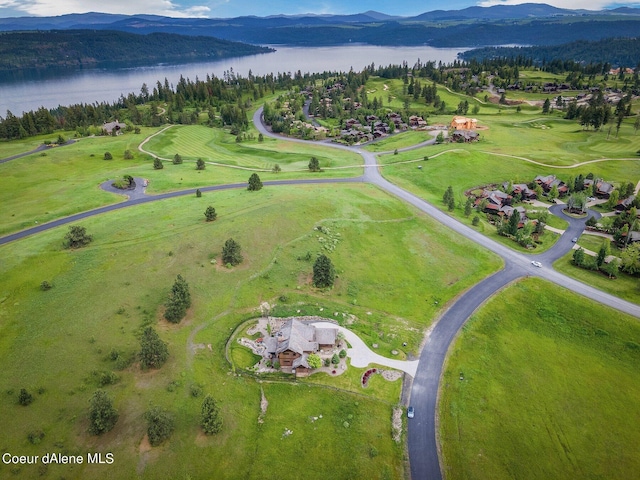 bird's eye view with a water and mountain view