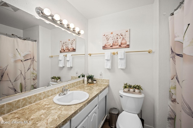 211 S Pinewood Dr, Post Falls, ID 83854 - full bath featuring visible vents, toilet, and vanity