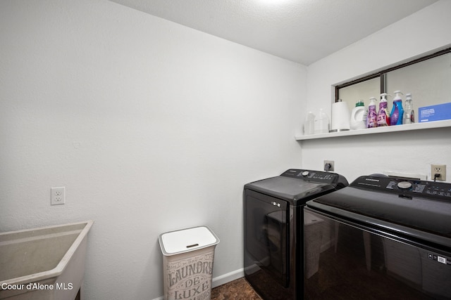 211 S Pinewood Dr, Post Falls, ID 83854 - washroom featuring laundry area, washer and clothes dryer, baseboards, and carpet floors