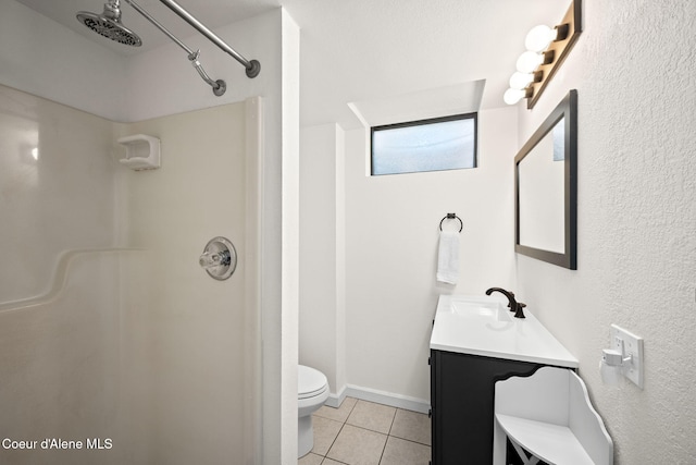 211 S Pinewood Dr, Post Falls, ID 83854 - full bath featuring vanity, toilet, tile patterned flooring, and a shower