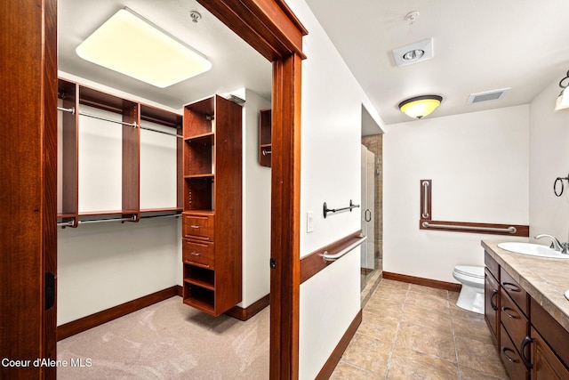 2151 N Main St # 226, Coeur Dalene, ID 83814 - full bath with vanity, toilet, baseboards, a shower stall, and visible vents