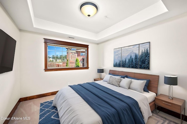 2151 N Main St # 226, Coeur Dalene, ID 83814 - carpeted bedroom featuring baseboards, a raised ceiling, and visible vents
